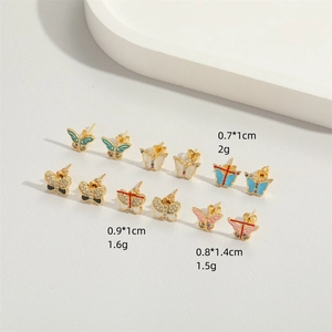 Minimalist gold butterfly stud earrings set with colorful enamel and zircon stones