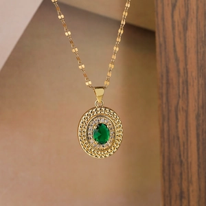 Vintage gold-plated necklace with green zircon teardrop pendant in a halo setting