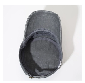 Detail view of washed cotton cadet cap interior with stitching and metal buckle strap