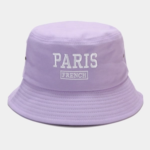 Macro detail of PARIS white embroidery on a light purple lavender cotton bucket hat