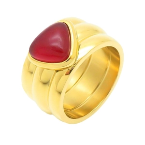 Luxurious wide gold ring with an irregular red turquoise inlay in a minimalist style