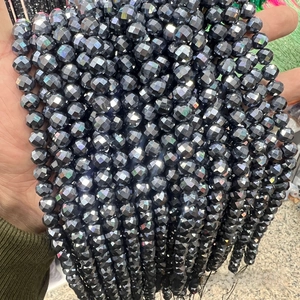 Close-up of faceted dark grey terahertz energy beads for DIY jewelry making