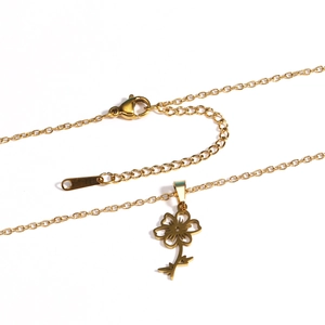 Flat lay of 18k gold plated stainless steel flower pendant necklace with lobster clasp