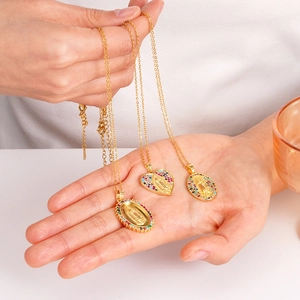 Golden Virgin Mary necklace set with colorful cubic zirconia in heart and oval shapes