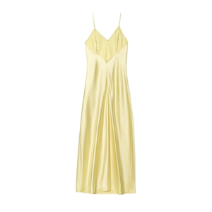 Detailed close-up of pale yellow satin slip dress featuring fine straps and smooth texture