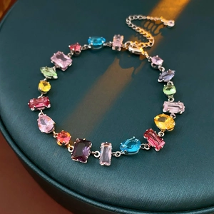 Close-up of multicolor zircon flower bracelet with adjustable clasp and silver chain