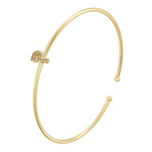 Detail of minimalist 18K gold plated bangle with micro-paved zircon letter charm