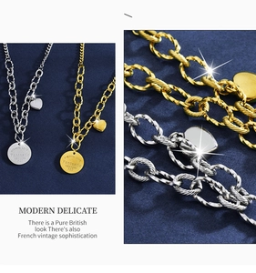 Detail of gold and silver heart necklaces with circular pendants on blue velvet