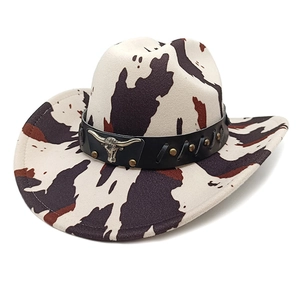 Western cow print cowboy hat featuring a metal bull head buckle and bronze studs decoration