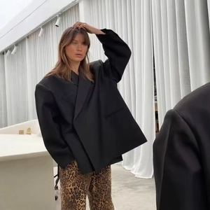 Women oversized black blazer with padded shoulders and side slits for a modern office look