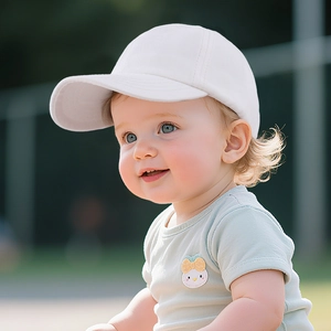 Close-up of a white cotton baseball cap for toddlers with a curved brim on a young child