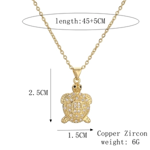 Detail of golden turtle necklace with cubic zirconia dimensions and material specs