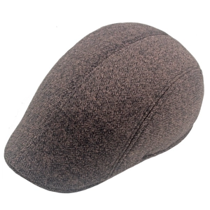 Detailed view of the dark brown thick fabric and neat stitching on a winter flat cap