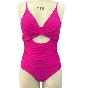 Close-up of rose red one-piece swimsuit with cutout twist front and pleated tummy control