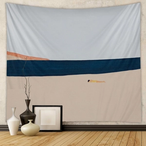 Detailed close-up of a bohemian abstract beach tapestry hanging on a textured wall