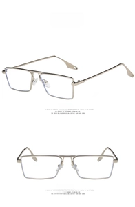 Detail view of silver metal square frames with transparent lenses and droplet temple tips