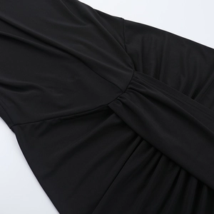 Detailed view of the elegant ruched waist design on a black backless hooded slit dress