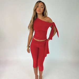 Chic red one-shoulder sleeveless top and slim fit shorts set for summer street fashion