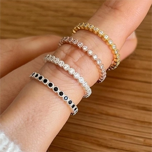 Stackable 925 sterling silver eternity rings set with zircon stones in four finishes
