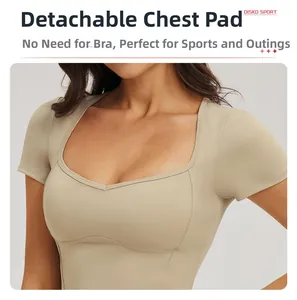 Detail of beige square neck sports top featuring functional removable chest pads