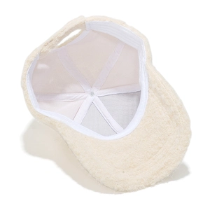 Detail view of the beige faux shearling baseball cap with durable white twill lining