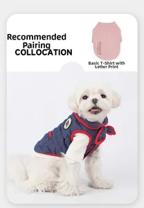 Detail of pet denim vest with red piping and pink printed base layer shirt