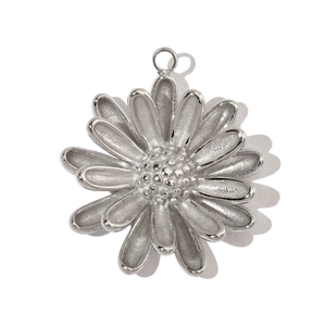 Detailed view of silver flower charm with double-layered petals and metallic finish