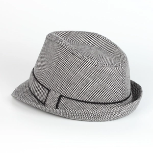 Detail of classic black and white houndstooth wool fedora hat with elegant black ribbon band