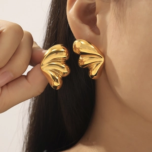 Minimalist 18k gold plated triple petal drop earrings worn by model for elegant style