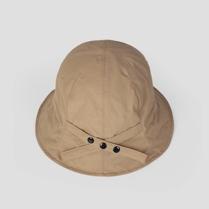 Detail of khaki bucket hat featuring back adjustable strap and black snap buttons