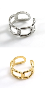 Detailed view of silver and gold chain-textured adjustable stainless steel rings
