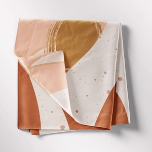 Close-up of bohemian tapestry with abstract geometric terracotta and peach prints