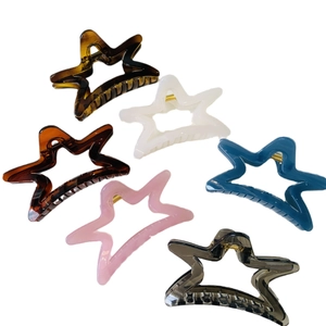 Star-shaped acrylic hair claws in six colors including amber and pink matte finishes