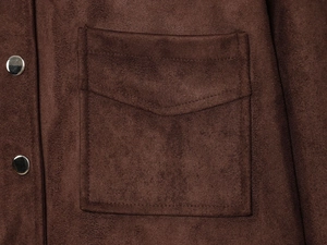 Detailed view of dark brown faux suede jacket with metallic silver snaps and square pockets