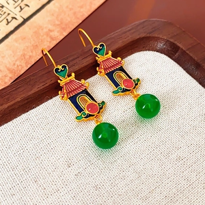 Detailed shot of gold-plated heart resin drop earrings with traditional Chinese enamel