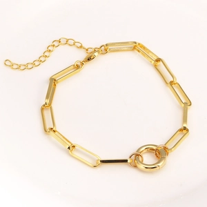 Detail of gold-plated rectangle link paperclip chain bracelet with a spring ring clasp