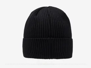 Detail view of the black ribbed knit beanie showing high-quality winter texture