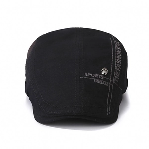 Retro black cotton beret with sports dream embroidery and silver skull badge