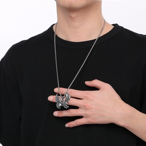 Men's vintage stainless steel eagle pendant necklace on a male model wearing a black t-shirt