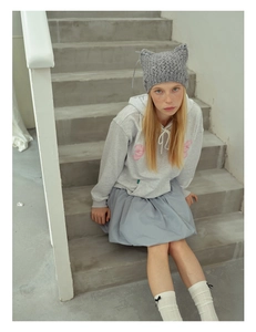 Detailed knit cat ear hat in grey with delicate hand-knotted hollow patterns