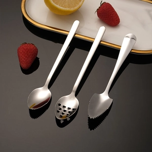 3-piece 304 stainless steel baby food spoons with serrated edges on a black surface
