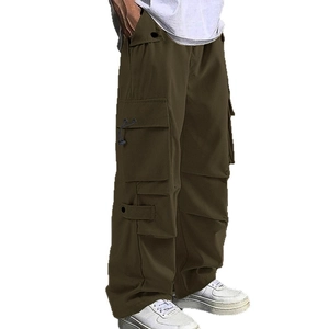 Men's loose fit parachute cargo pants in olive green with multi-pocket utility design