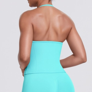 Macro shot of turquoise seamless backless sports top featuring elastic knitted texture