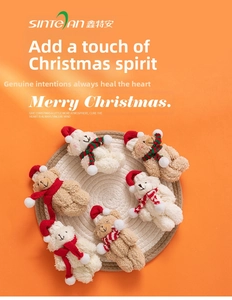 Macro detail of plush Christmas bears with festive scarves and red hats on a warm background