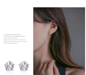 Macro view of S999 silver star earrings with high-grade zircon on a model and close-up