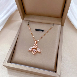 Rose gold angel wing heart necklace with sparkling zircon in a jewelry box