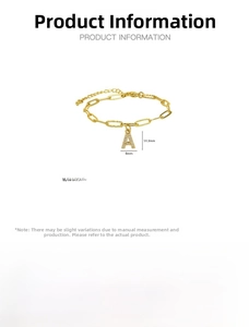 Detailed view of gold paperclip chain bracelet with micro-paved zircon letter A pendant
