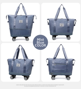 Multiple views of misty blue large travel bag with universal wheels and trolley sleeve