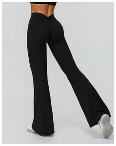 Detail view of high waisted black flare yoga pants showing butt lifting ruched seam