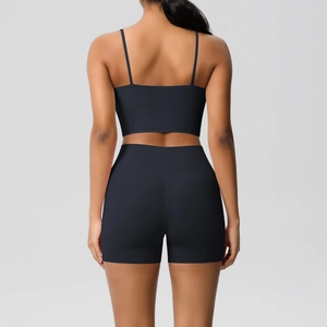 Detailed back view of high-waisted seamless biker shorts and thin strap sports bra set